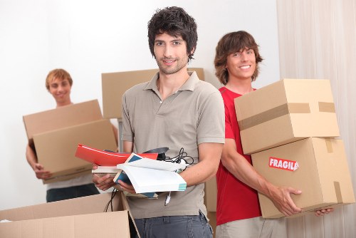Packed moving boxes and protected household items ready for transport