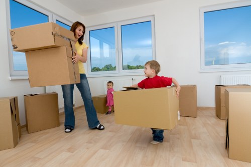 Professional movers handling furniture during house removals in Homerton