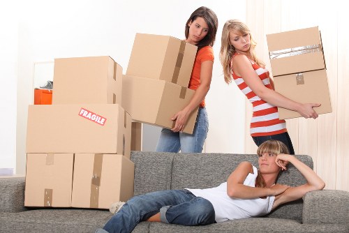 Team member using safe lifting techniques during a move